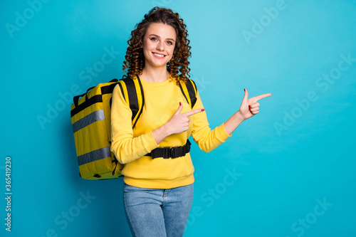 Portrait of her she nice attractive pretty cheerful wavy-haired girl bringing takeout lunch meal showing copy space ad advert advice isolated bright vivid shine vibrant blue color background