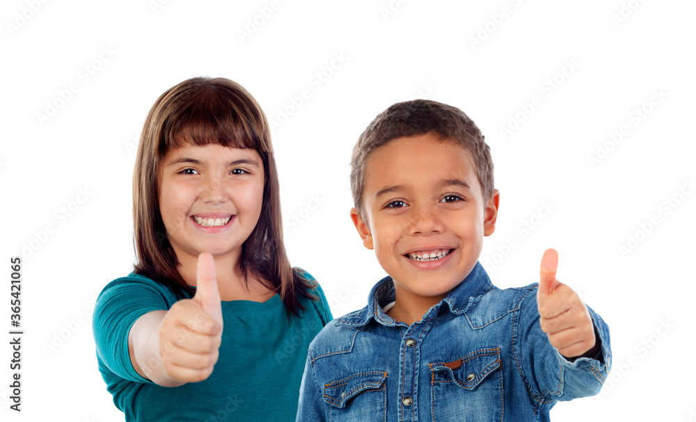 Happy children saying Ok with the thumb up