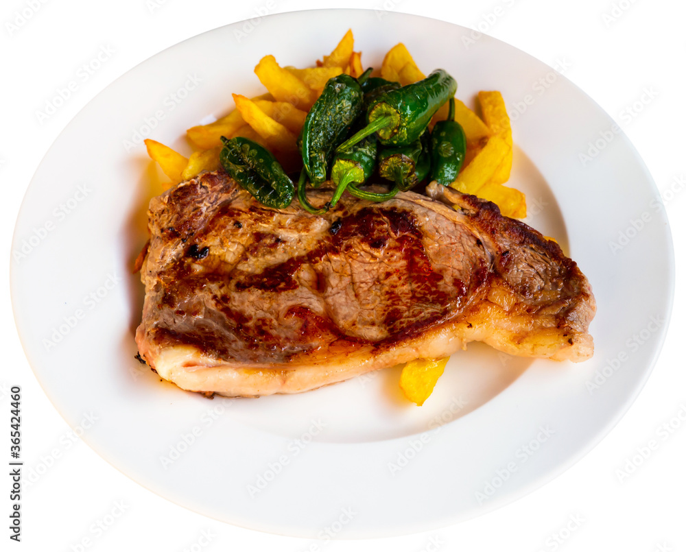 Healthy dinner veal steak baked in oven served with chips and bell pepper. Isolated over white background