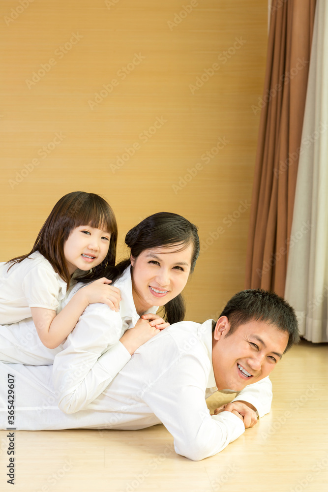 Happy family smiling together at home Happy family smiling together at home