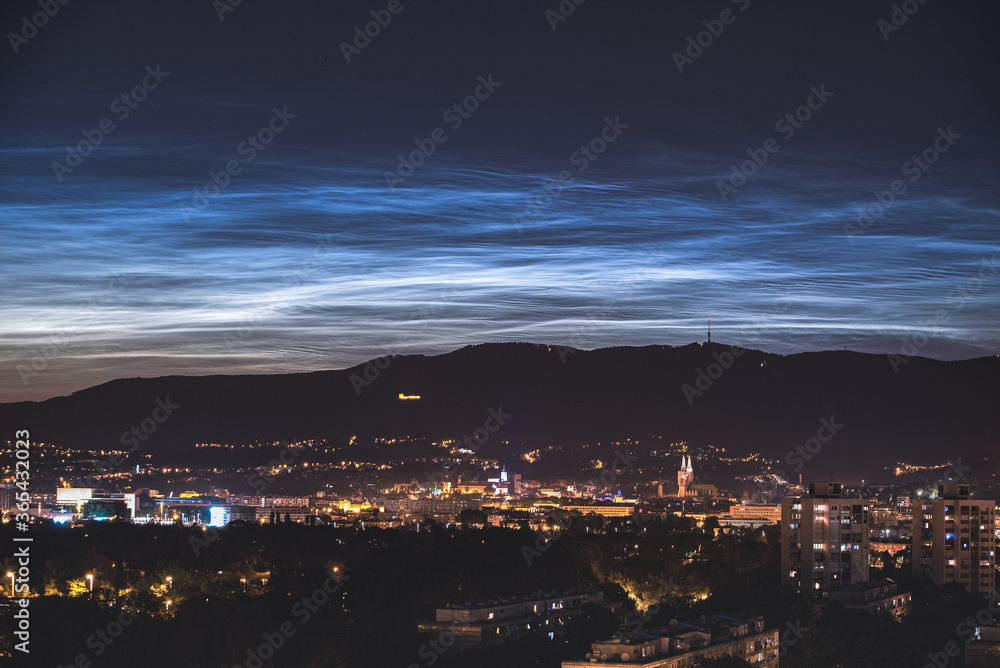 NLC clouds over the city