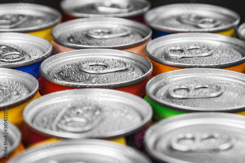 aluminum cans with carbonated water, energy drinks or beer. Background of aluminum cans