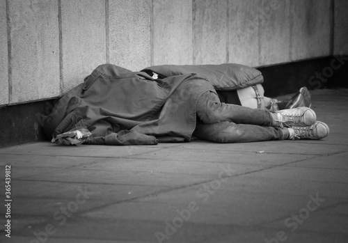 Photos Two homeless people sleeping rough on the streets of London black and white