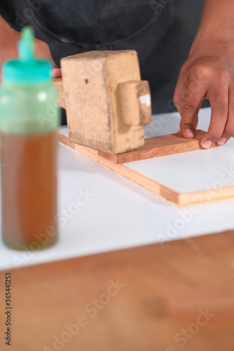 Process of gluing plank of plywood