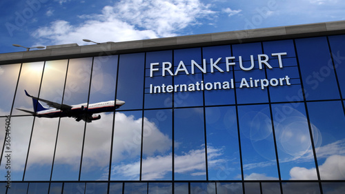 Airplane landing at Frankfurt mirrored in terminal