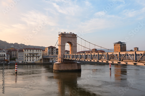 Scenic panorama of Vienne city with the footbridge over Rhone River  photo