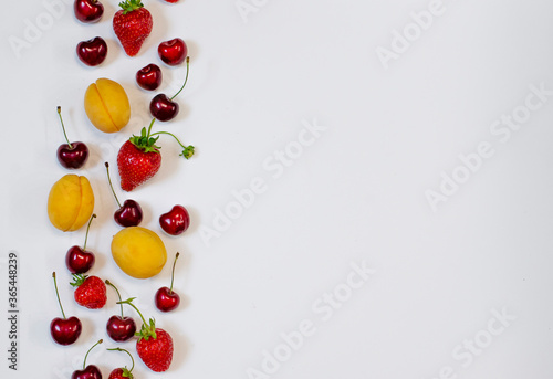 Assorted fresh fruits, berries isolated on white background
