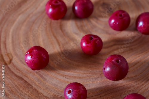 Ripe cherry berry on a wooden slice of wood