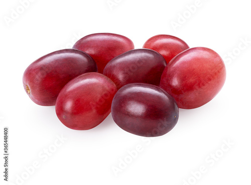 Grape bunch isolated on white background. Sweet ripe fresh pink fruit. Heap of red cardinal grapes. Clipping path. Full depth of field.