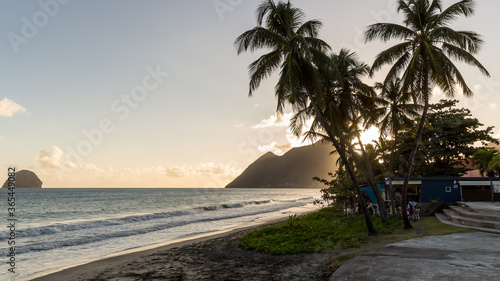 sunset behind the mountains on Diamant Beach in Martinique