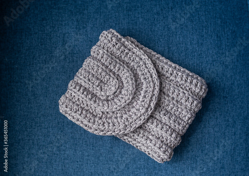 Gray knitted bag. Handmade crochet purse. Closeup