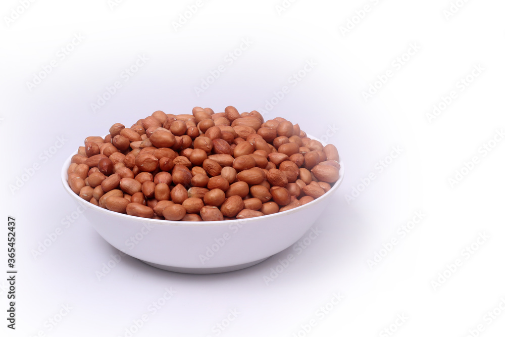 Peanuts beans in a bowl on white background