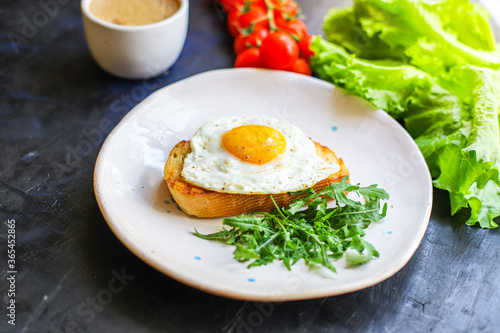 fried egg and toast bread delicious breakfast snack yolk and protein food background top view copy space for text organic eating healthy raw Takeaway