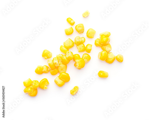 Some sweet grains seeds of canned corn isolated on white background, top view 