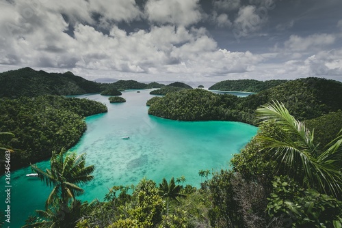 Landscape of the Wajag Island surrounded by the sea under a cloudy sky in Indonesia photo