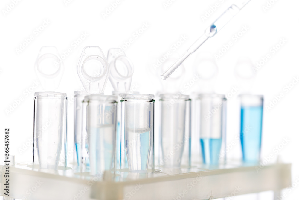 microbiological pipette in the genetic laboratory. study of a virus or vaccination. blue tinted. microbiological pipette in the genetic laboratory. study of a virus or vaccination. blue tinted.