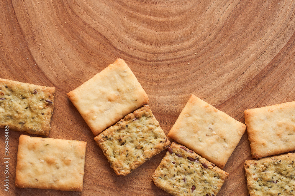 Wheat dry biscuits with spices on a wooden table Wheat dry biscuits with spices on a wooden table