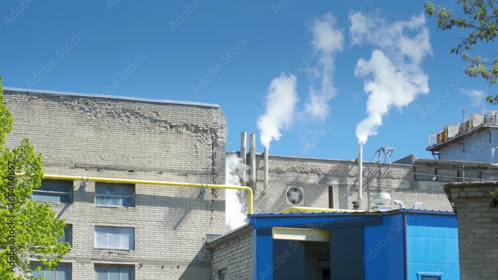 White smoke coming from the factory pipes White smoke coming from the factory pipes