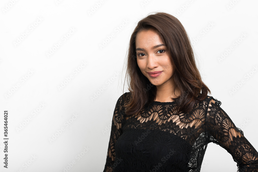 Studio shot of young beautiful Asian woman Studio shot of young beautiful Asian woman