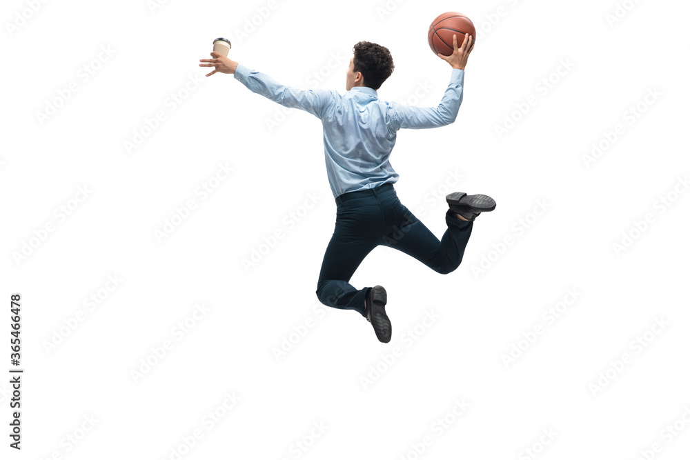 Target. Man in office clothes playing basketball on white background like professional player, sportsman. Unusual look for businessman in motion, action with ball. Sport, healthy lifestyle, creativity