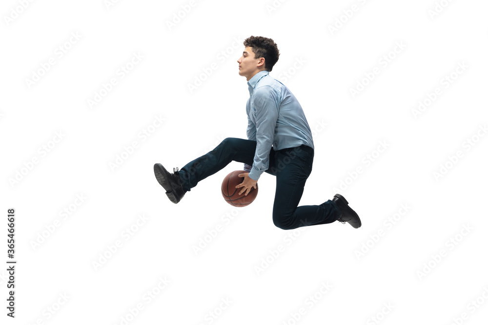 Target. Man in office clothes playing basketball on white background like professional player, sportsman. Unusual look for businessman in motion, action with ball. Sport, healthy lifestyle, creativity
