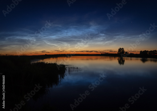 Ural landscape at night on the river with silvery clouds, Russia, Ural Sverdlovsk region © 7ynp100