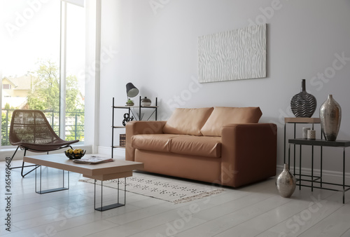 Modern living room interior with stylish leather sofa