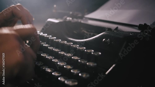 hands typing on vintage typewriter