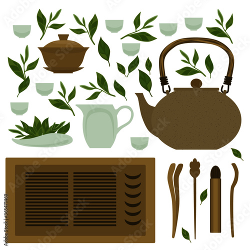 A set of items for traditional Chinese tea drinking Pin Cha on a white background. The tea Board, kettle, gaiwan and the green tea leaves. Isolated objects.