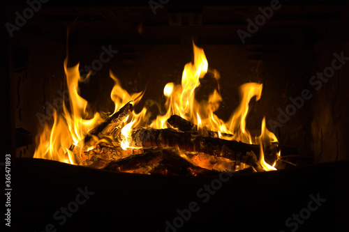 Fireplace fire with flames and black background