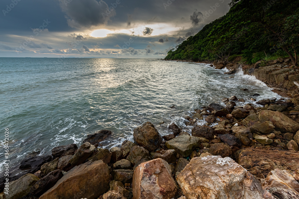 Coastal Sunset, Rocky Coastline with texture of cloudy sky in Chanthaburi province, Thailand