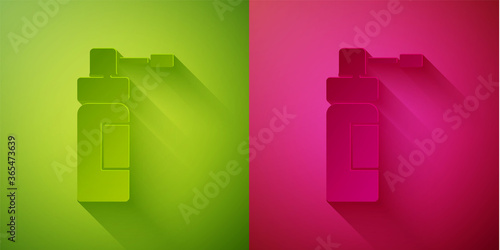 Paper cut Medical bottle with nozzle spray for the treatment of diseases of the nose and throat icon isolated on green and pink background. Paper art style. Vector Illustration.