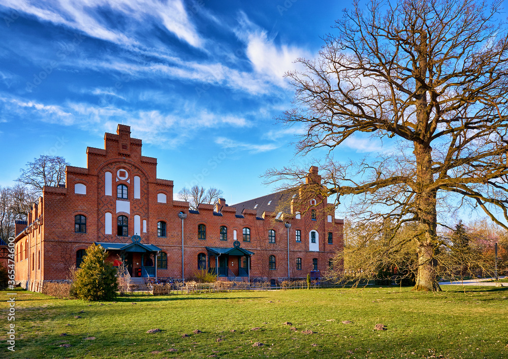The Marstall is a historic German brick house with a large old oak tree in Wiligrad. The Marstall is a historic German brick house with a large old oak tree in Wiligrad.