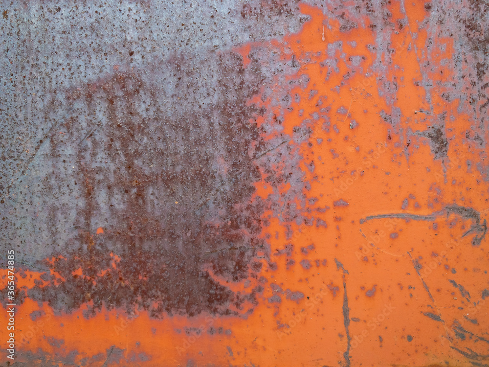 Rusty blue and orange painted detailed metal texture background. Close up view of grunge metal surface.