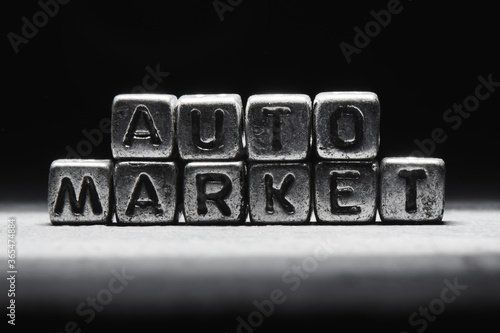 Inscription auto market on metal cubes in grunge style on a black темно серый background isolated