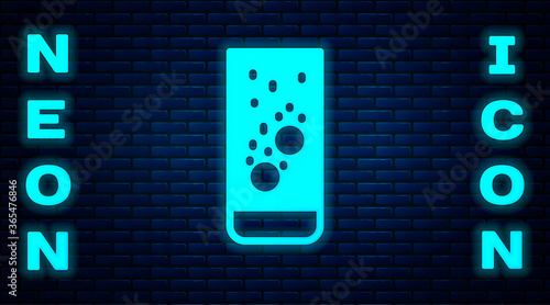 Glowing neon Effervescent aspirin tablets dissolve in a glass of water icon isolated on brick wall background. Vector Illustration.