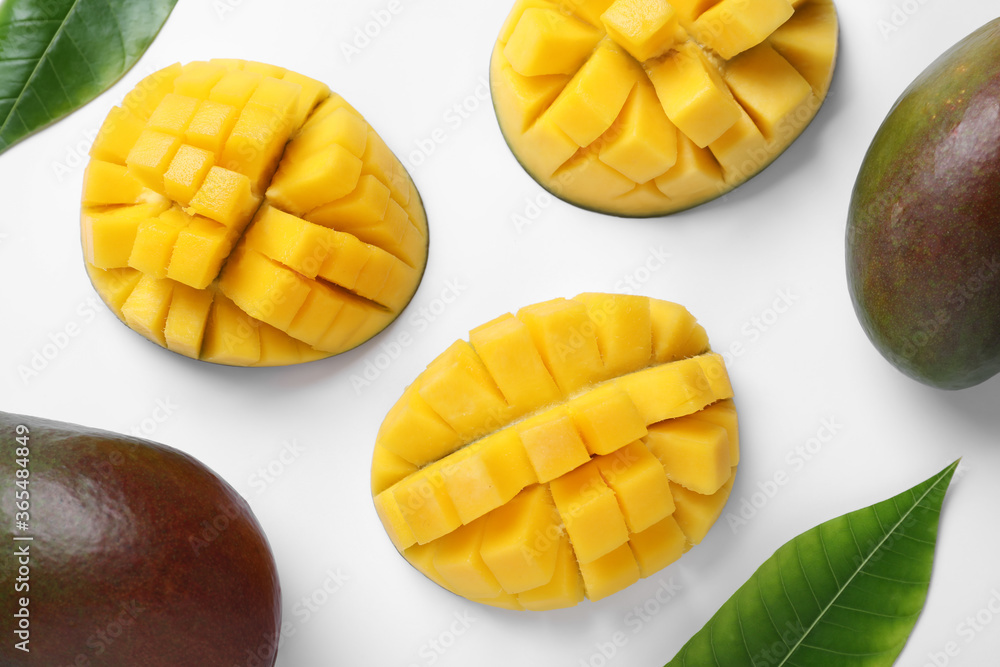 Ripe mangoes on white background, flat lay Ripe mangoes on white background, flat lay