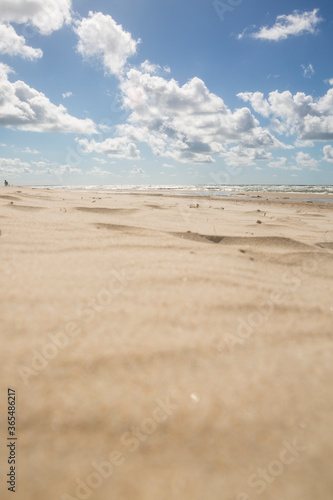  Sunset on the beach. Sunny day on the beach with blue sky and clouds. photo