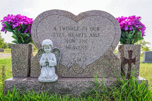 A gravestone and epitaph for a young child.