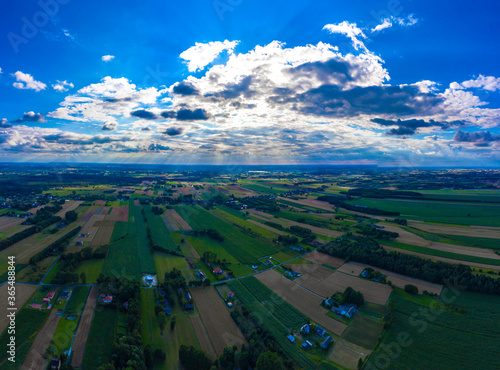 Stunning aerial panorama from a drone of countryside  village  green fields and trees  agriculture concept.