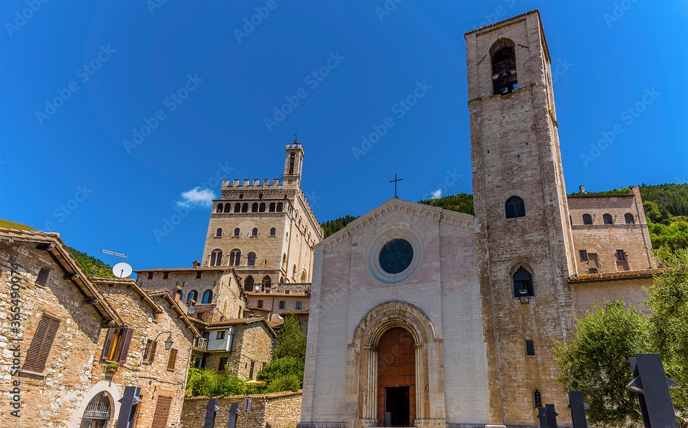 Churches line the hill in the cathedral city of Gubbio, Italy in summer