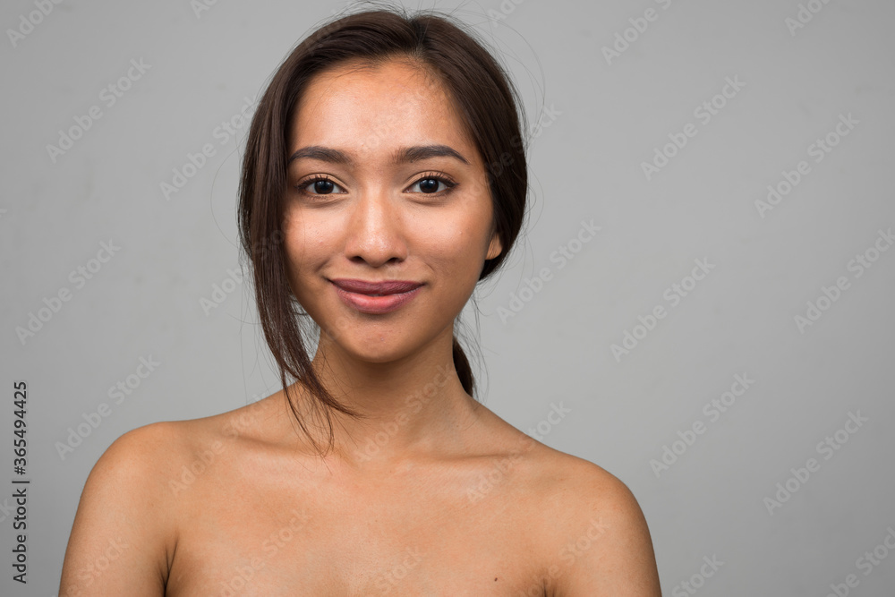Portrait of young beautiful Asian woman shirtless Portrait of young beautiful Asian woman shirtless