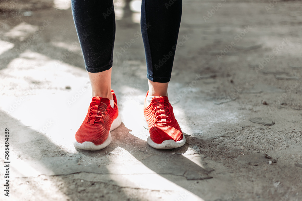 Close-up of red pair of female fitness sneakers. Close-up of red pair of female fitness sneakers.