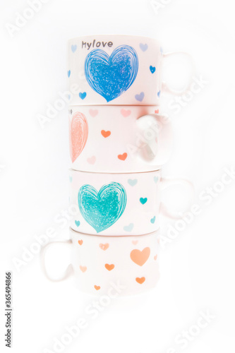 Stack of tea cups with romantic sign