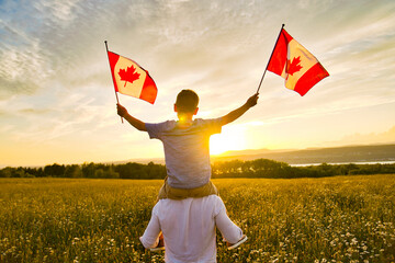 Papier peint photo Canada Adorable cute happy Caucasian boy holding Canadian flag on the father shoulder  © Louis-Paul Photo
