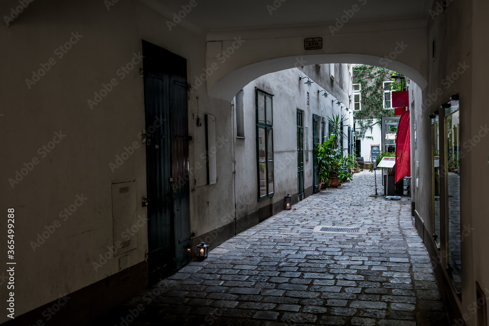 Entrance To The Backyard Of A Historic Building With A Picturesque Restaurant In The Inner City Of Vienna In Austria