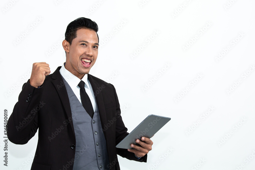 Close up portrait young man holding digital tablet and looking at camera. Black lives matter concept. Handsome man is posing on copy space. Black and white photo in studio. Close up portrait young man holding digital tablet and looking at camera. Black lives matter concept. Handsome man is posing on copy space. Black and white photo in studio.