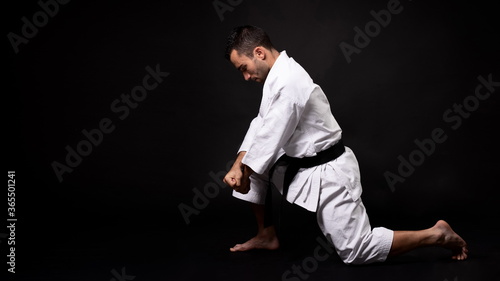 karateka practicing kata with black background