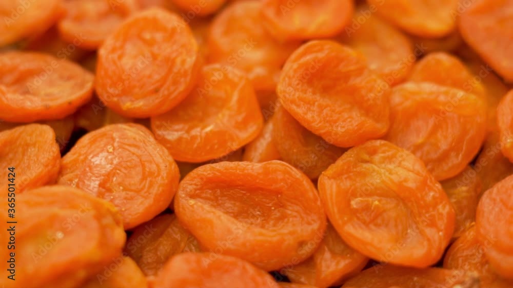 Close-up of Dried Apricots. Rotation. Dried Apricots Isolated, Dried Fruit. The Concept Of Healthy Vegetarian Food. Vegan Food. Close-up of Dried Apricots. Rotation. Dried Apricots Isolated, Dried Fruit. The Concept Of Healthy Vegetarian Food. Vegan Food.
