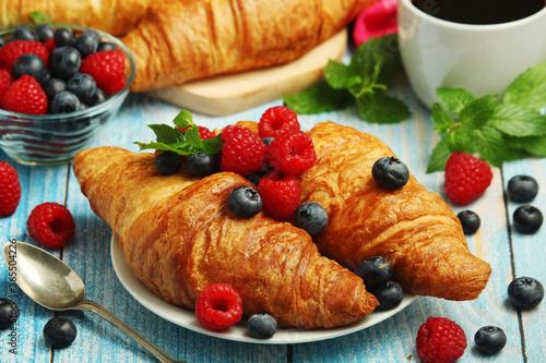 Croissants with fresh berries for breakfast